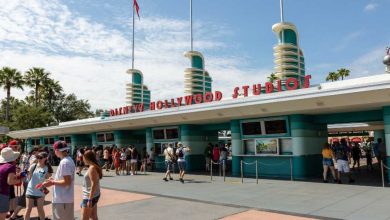 Guests outside of Disney's Hollywood Studios entrance at Disney World park.